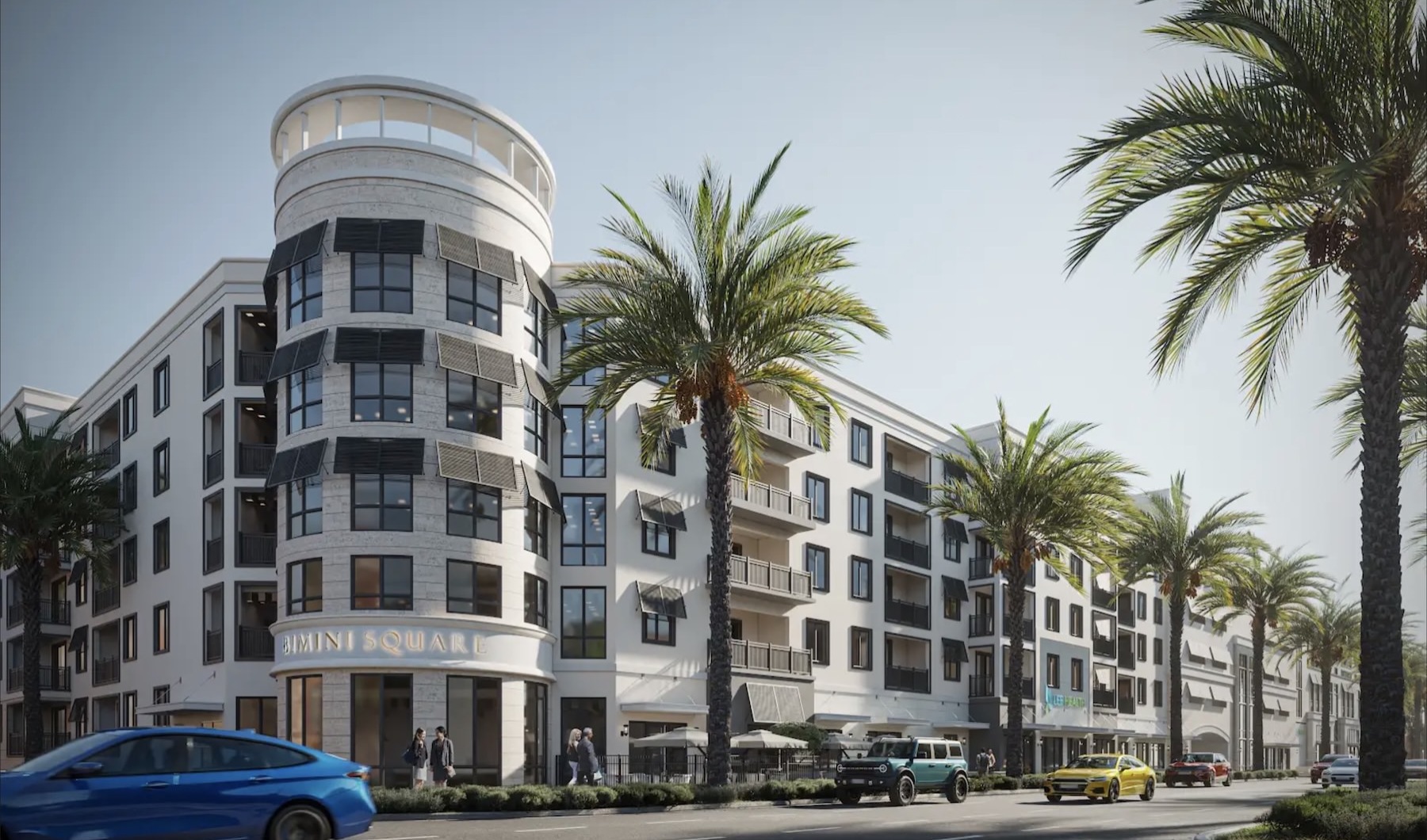 a large building with many windows and palm trees